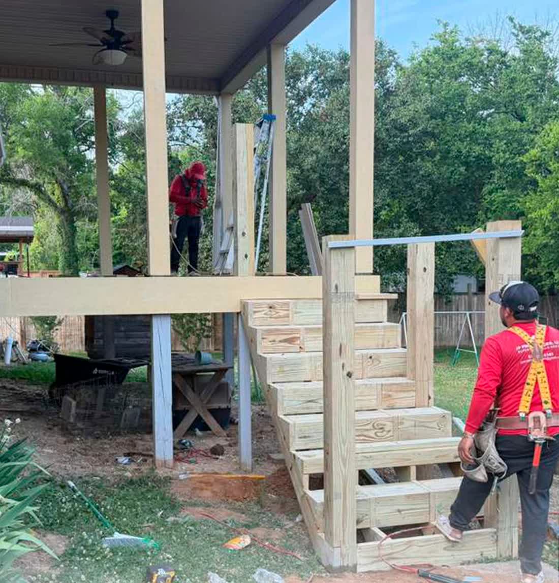 Porch structure being rebuilt by the crew