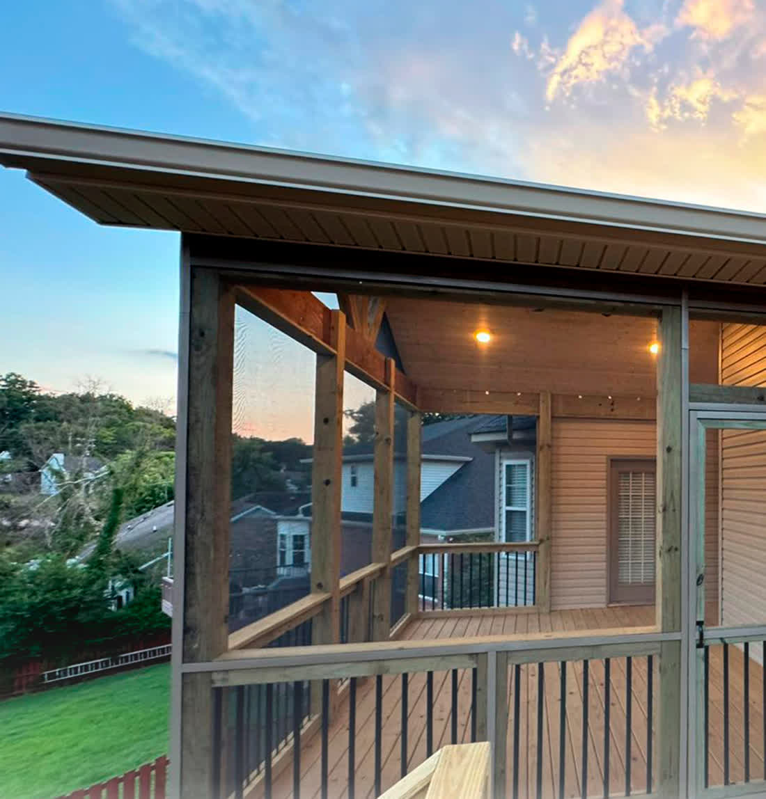 Covered porch with tongue and groove ceiling at dusk