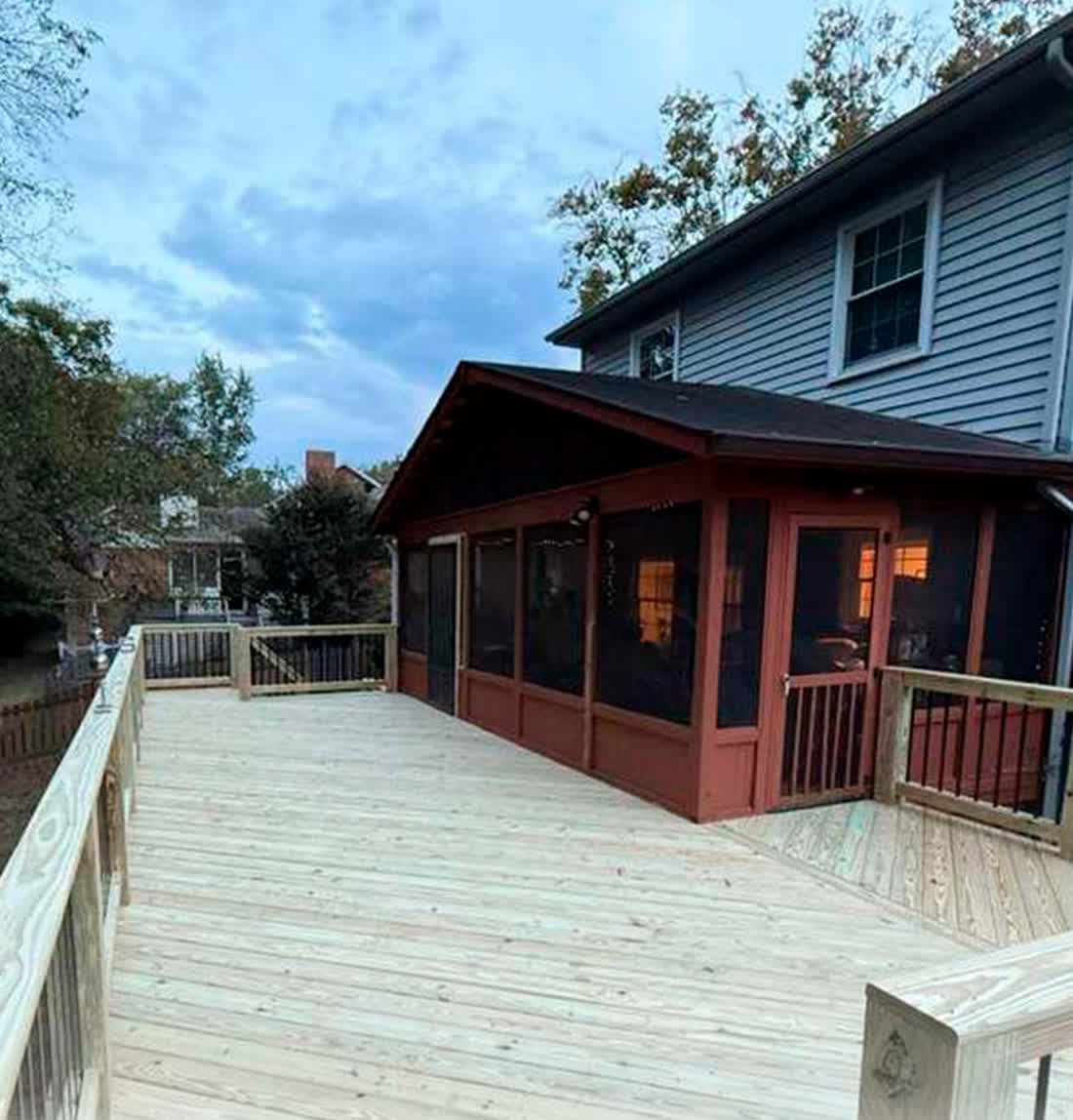 Screened porch with a new pressure-treated deck