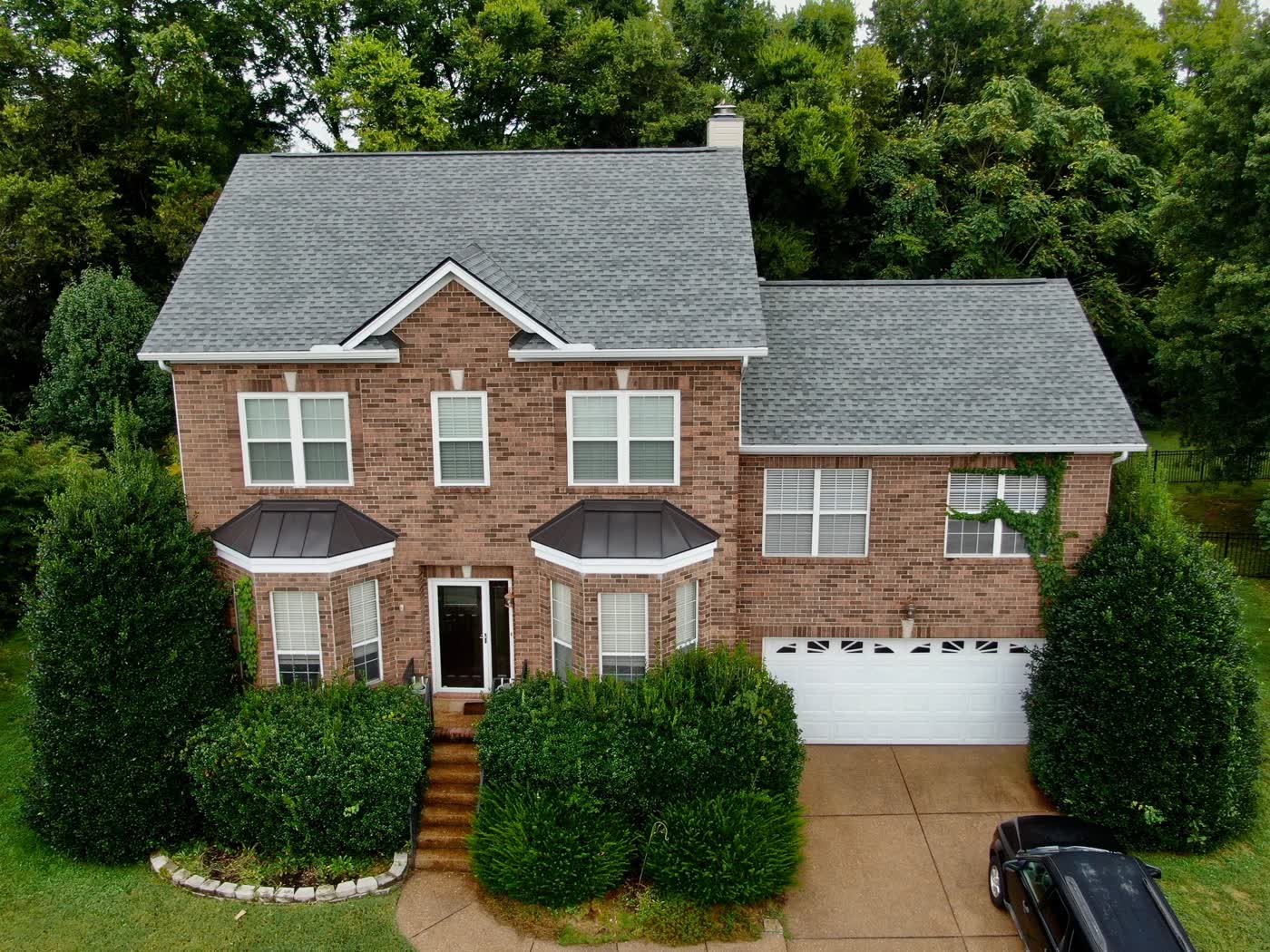 Completed roof on a brick two-storey home