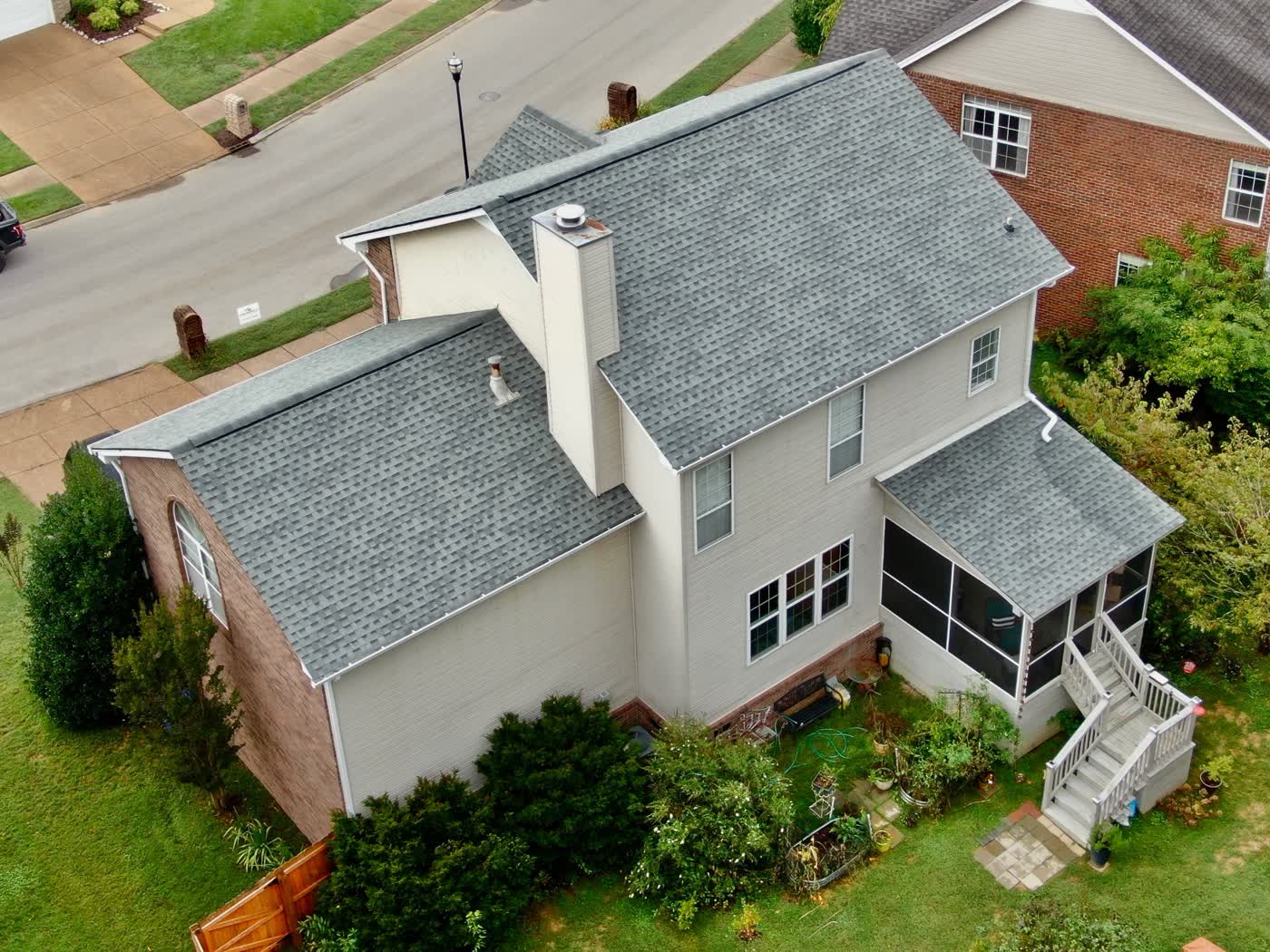 Finished roof with chimney and screened porch
