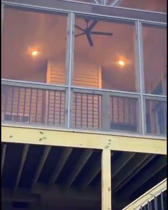 Screened porch lit at dusk, built by JP Pro Services
